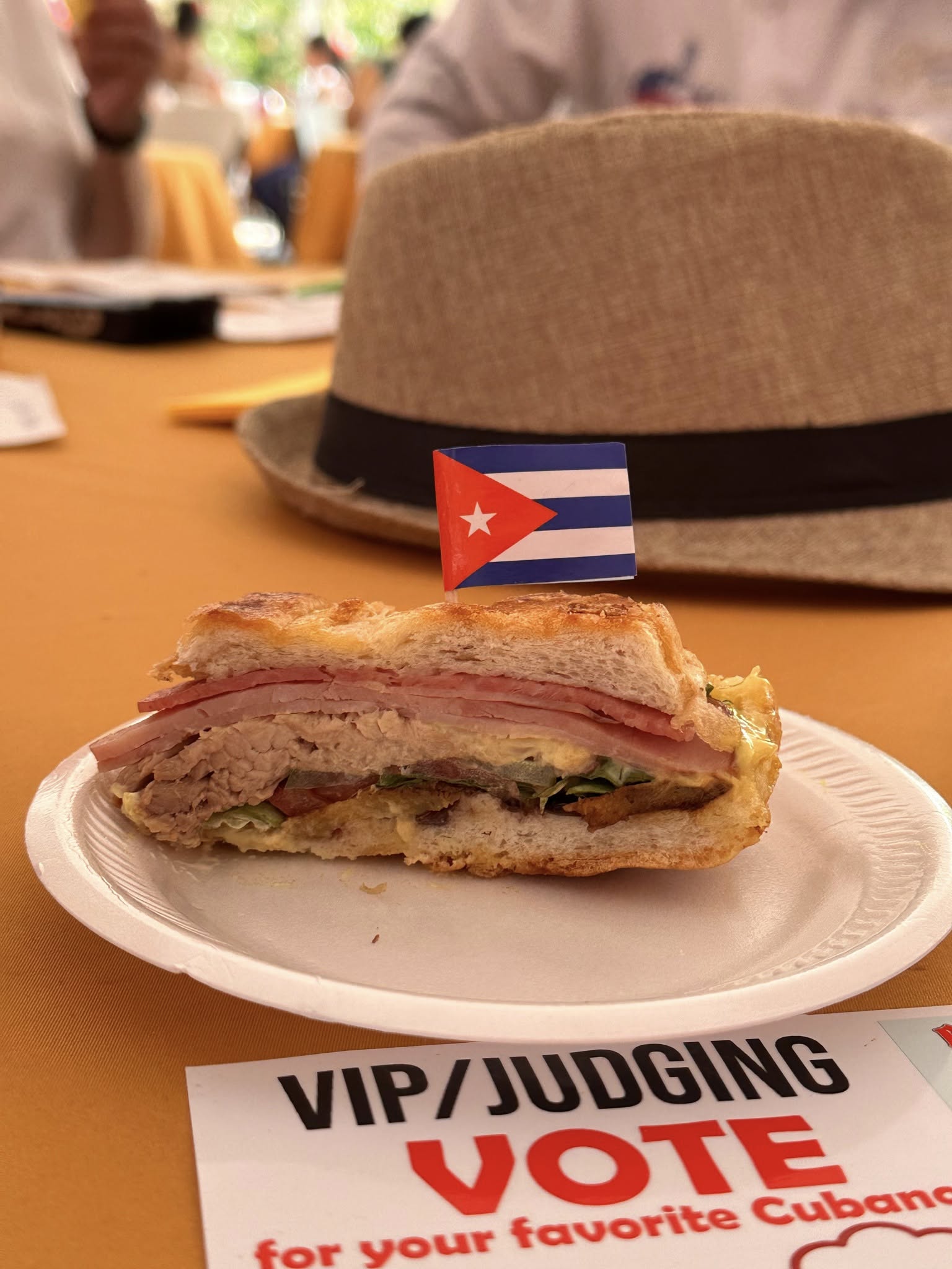 Festival attendees enjoying Cuban sandwiches